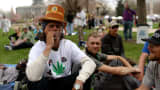 DENVER APRIL 19: J.D. from South Dakota is smoking marijuana during 420 Rally in Civic Center Park. Denver, Colorado. April 19, 2014.